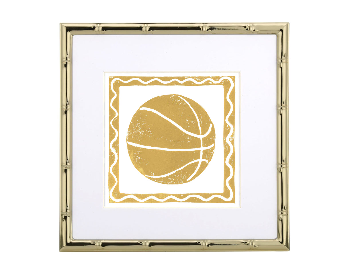 Framed artwork of a gold basketball with decorative border on white background