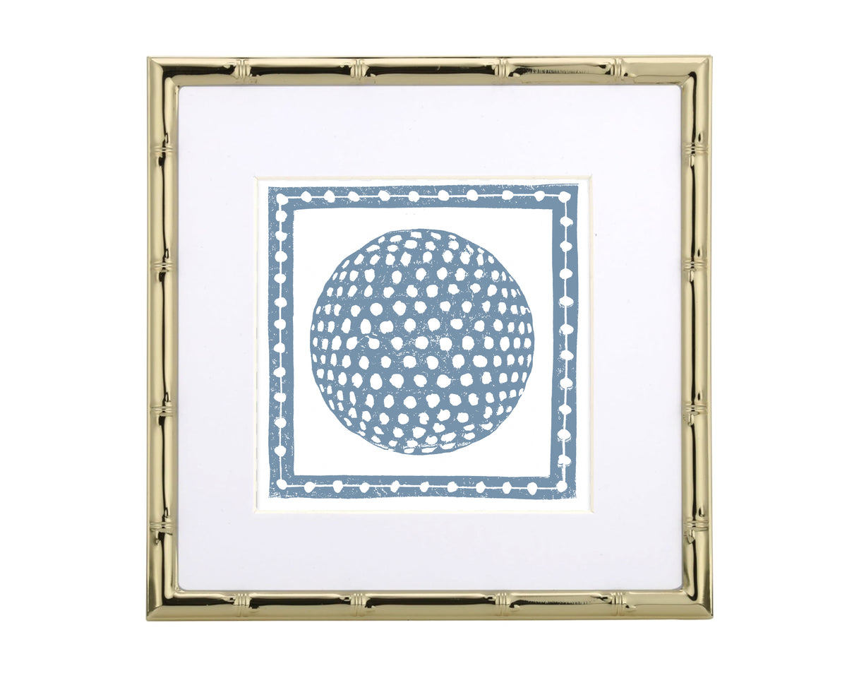 Framed artwork with a blue golf ball on a white background
