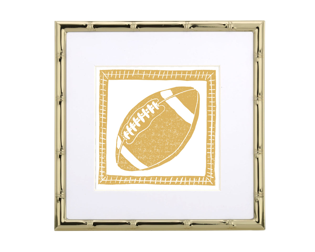 Framed artwork of a yellow football on a white background