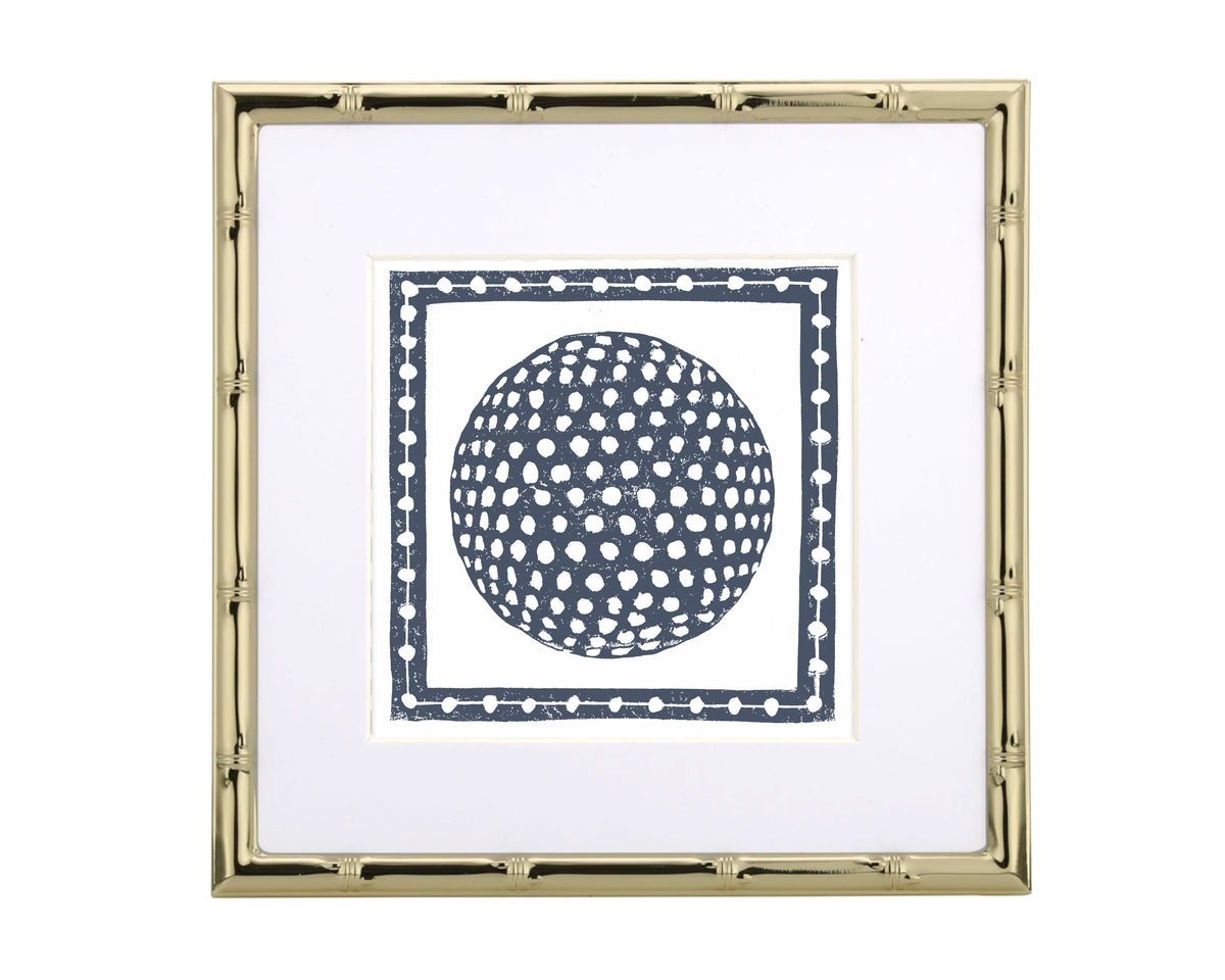 Framed artwork with a navy golf ball design on a white background