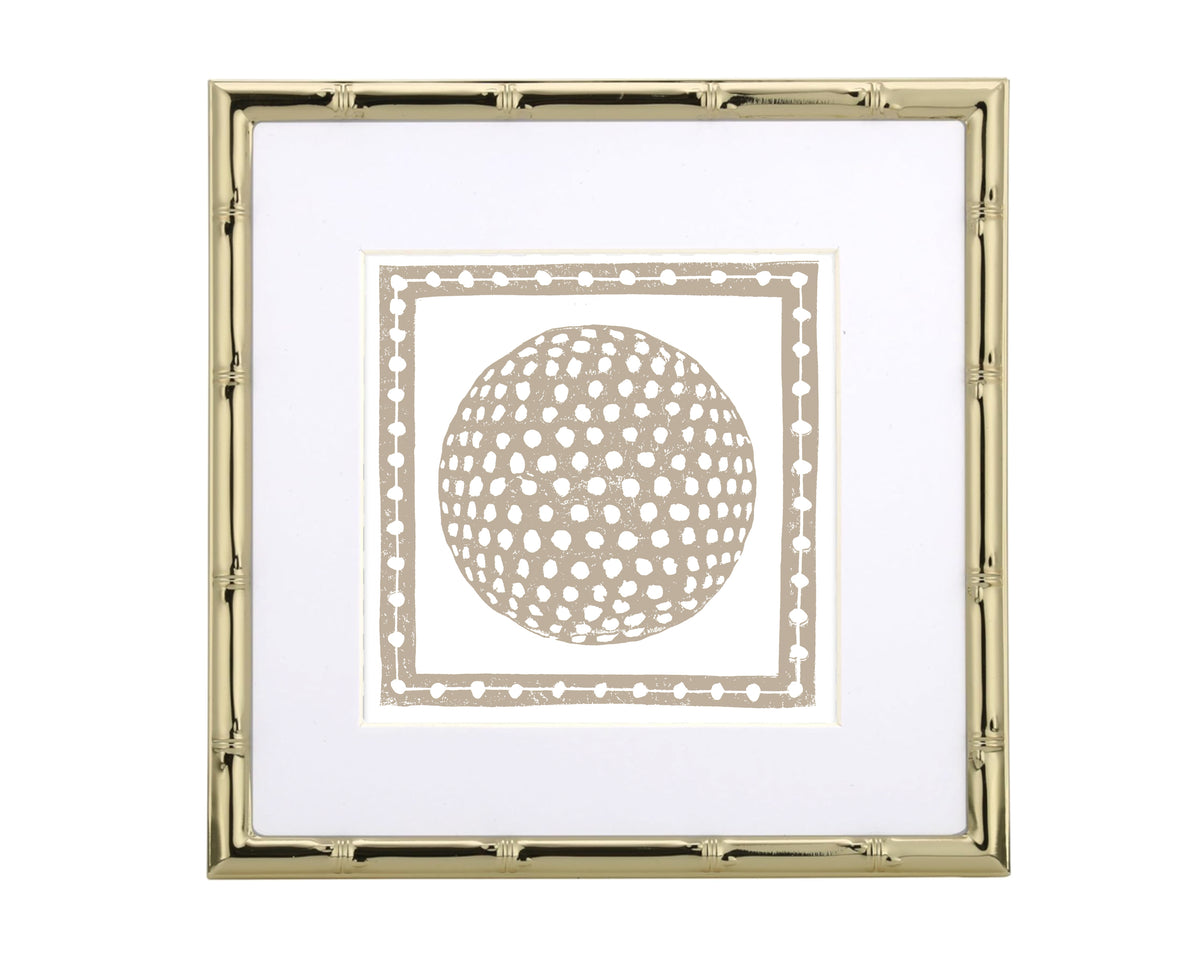 Framed artwork with a gold border and golf ball design on a white background