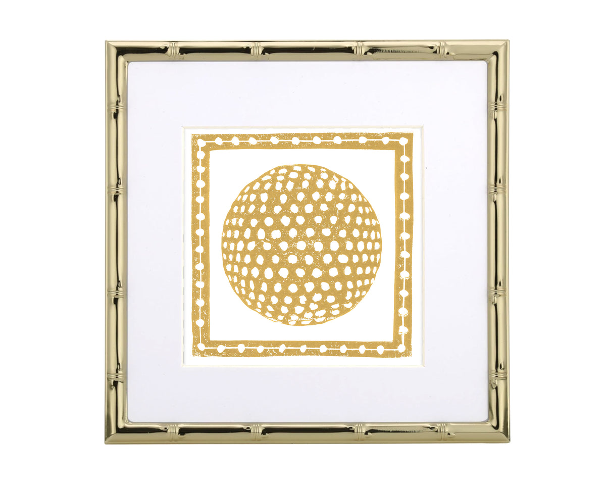 Framed artwork with a gold golf ball design on a white background