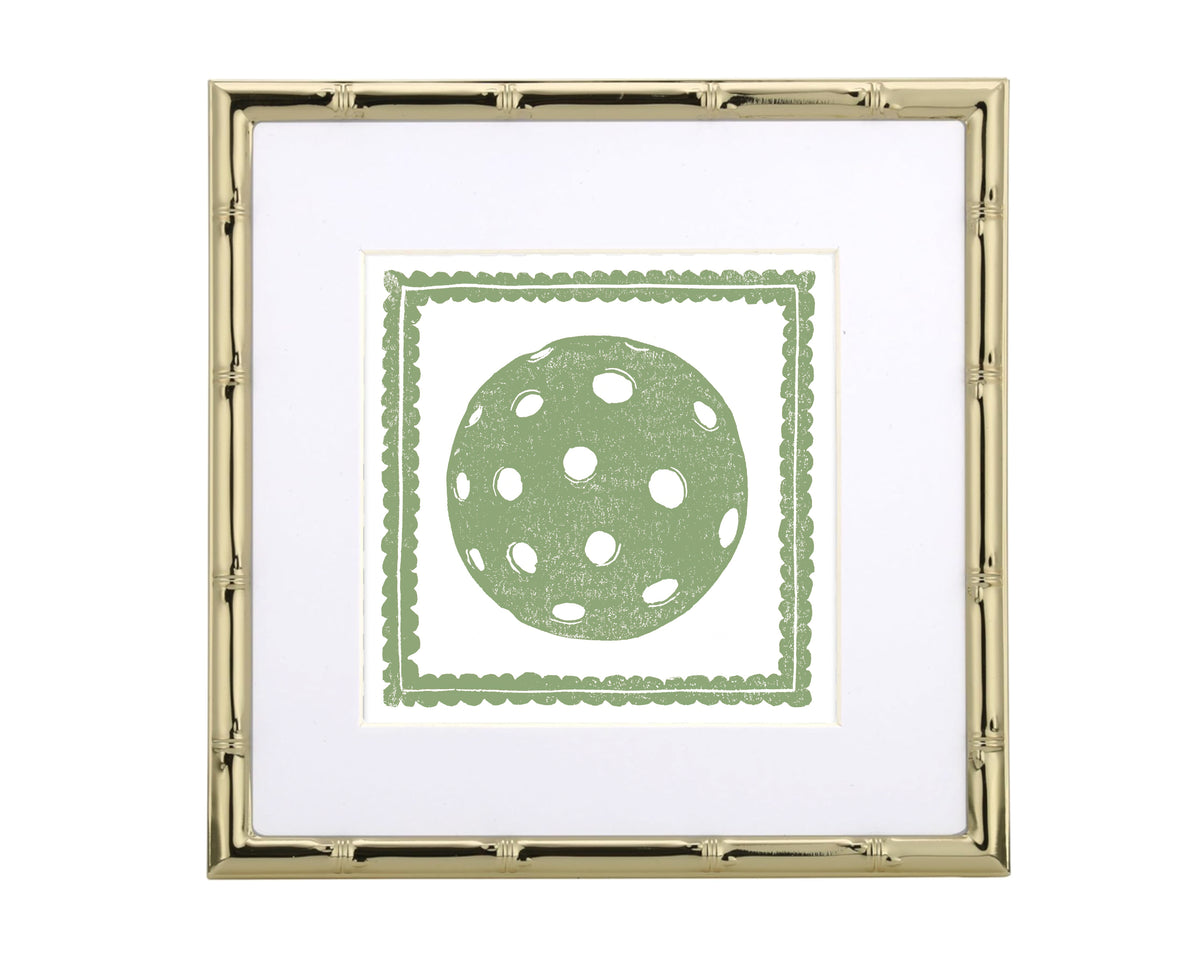 Framed artwork with a green polka dot pickleball design on a white background