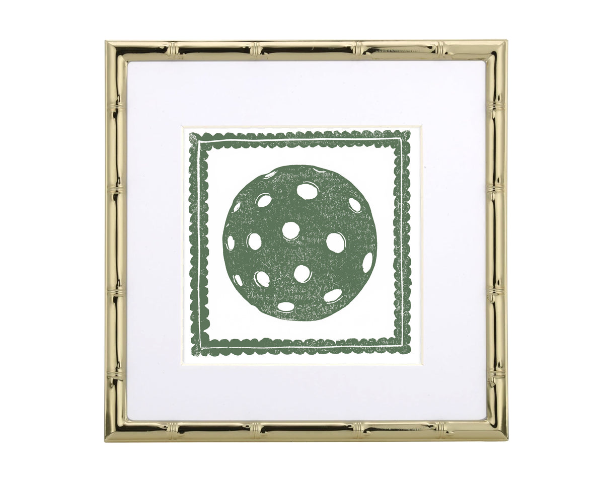 Framed artwork with a green polka dot pickleball design on a white background