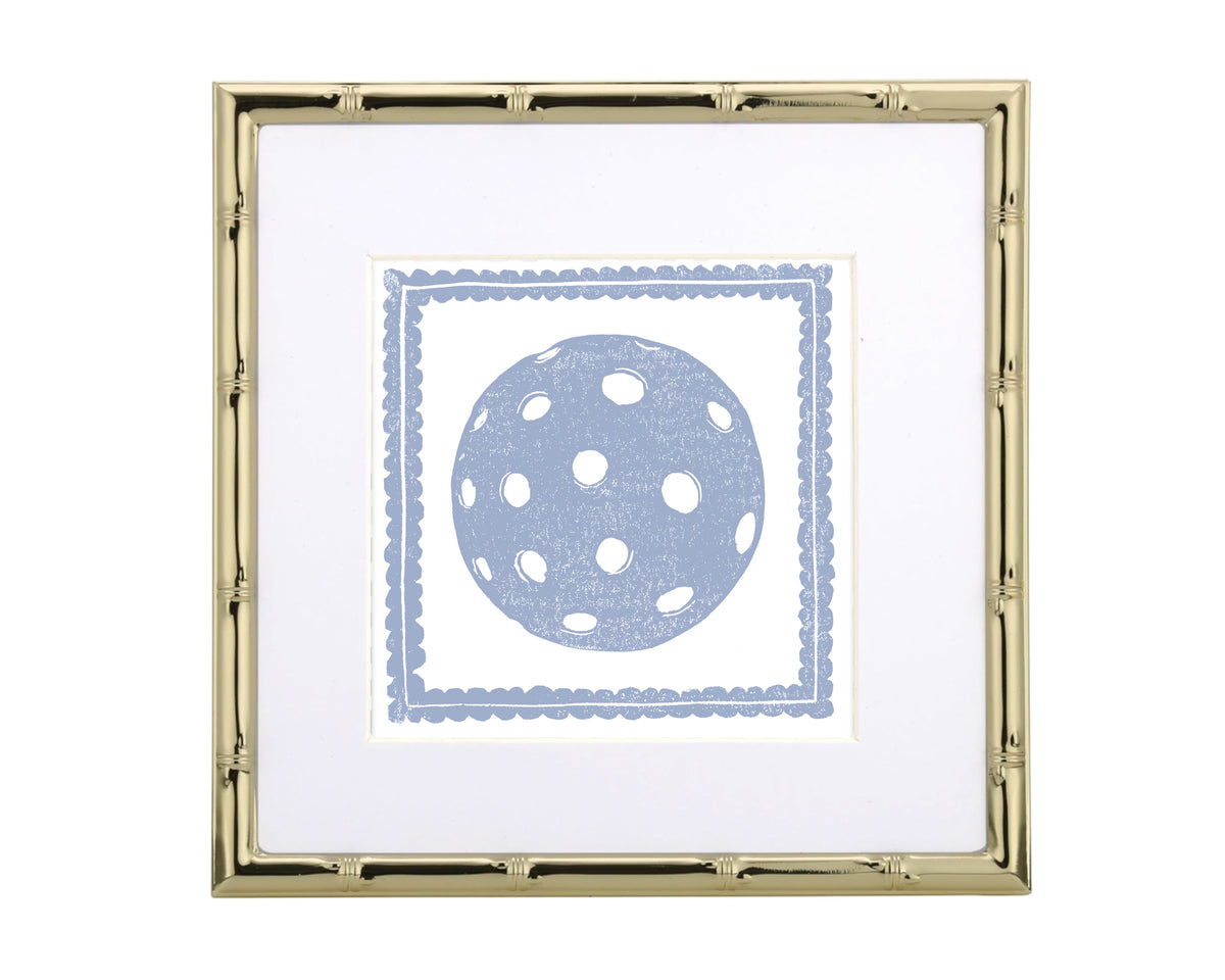 Framed artwork with a blue polka dot pickleball design on a white background
