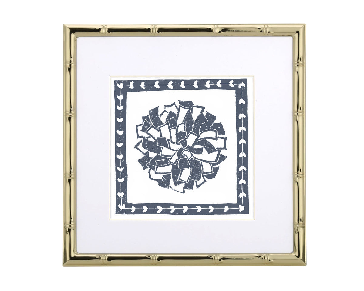 Framed artwork with a decorative pompon design on a white background