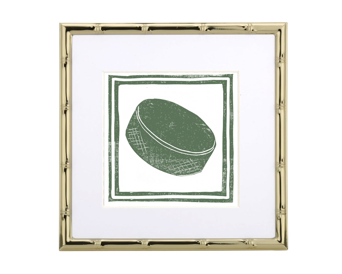 Framed artwork with a green object on a white background