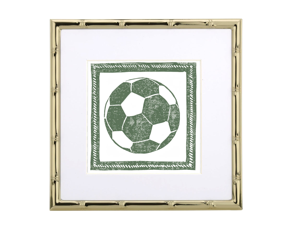 Framed artwork of a green soccer ball design on a white background