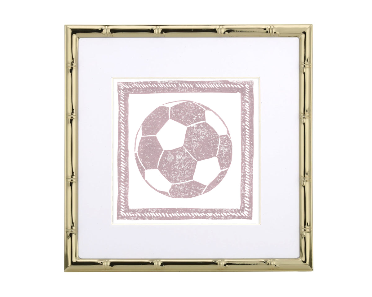 Framed artwork of a pink soccer ball on a white background