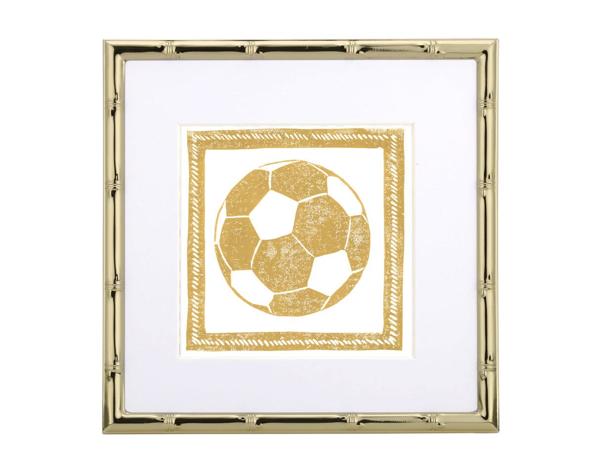 Gold-framed artwork with a gold soccer ball design on a white background