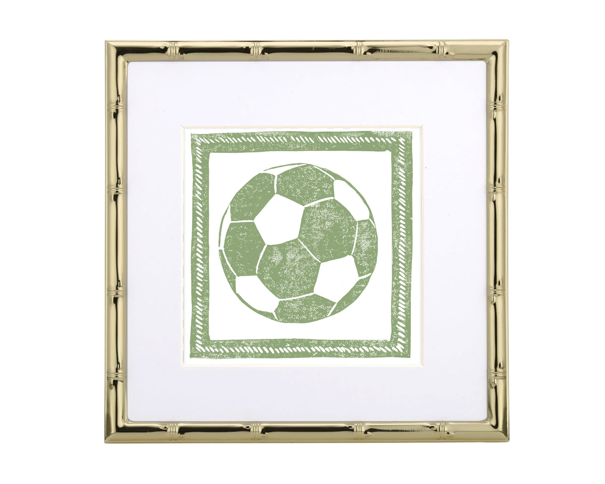 Framed artwork of a green soccer ball design on a white background