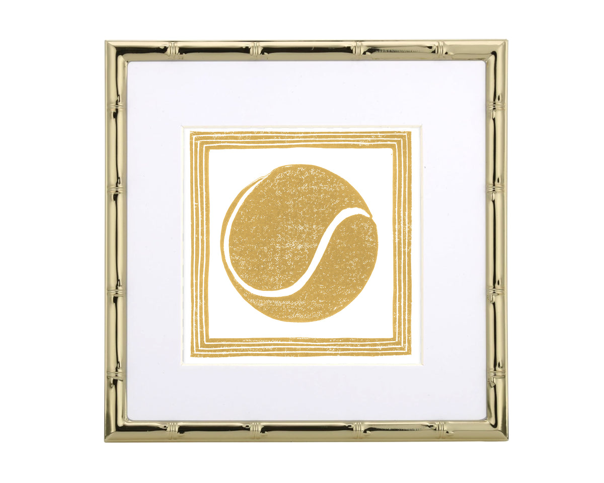 Gold-framed artwork with a yellow tennis ball design on a white background