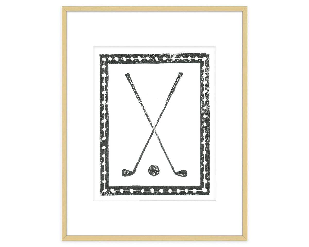 Framed artwork with crossed golf clubs and a ball on a white background
