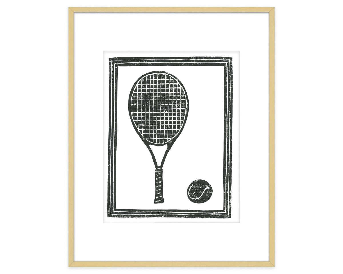 Framed artwork of a black and white illustration of a tennis racket and ball.