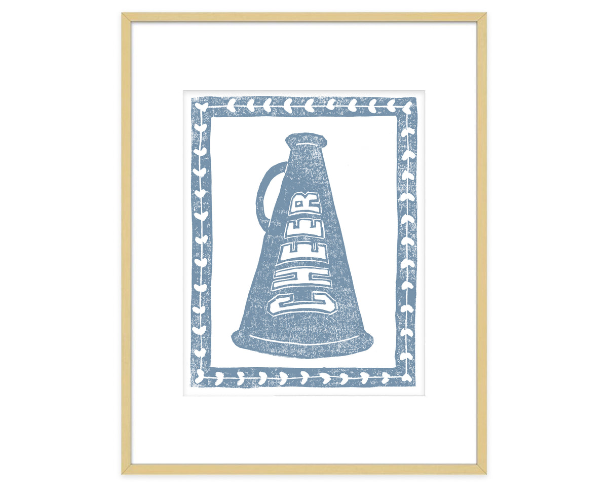 Framed artwork of a megaphone with 'CHEER' text on a white background