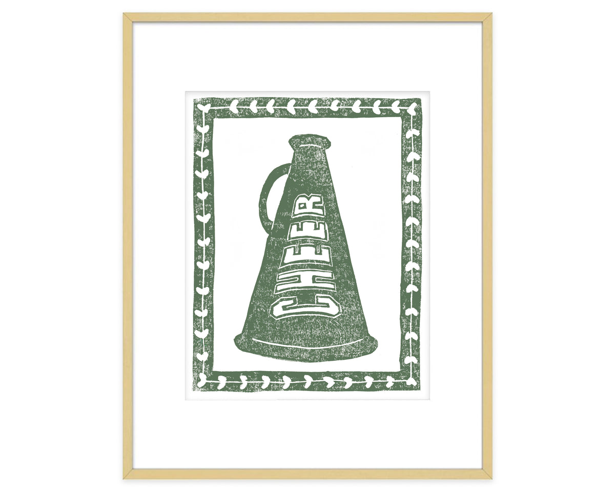 Framed artwork of a green megaphone with 'CHEER' text on a white background