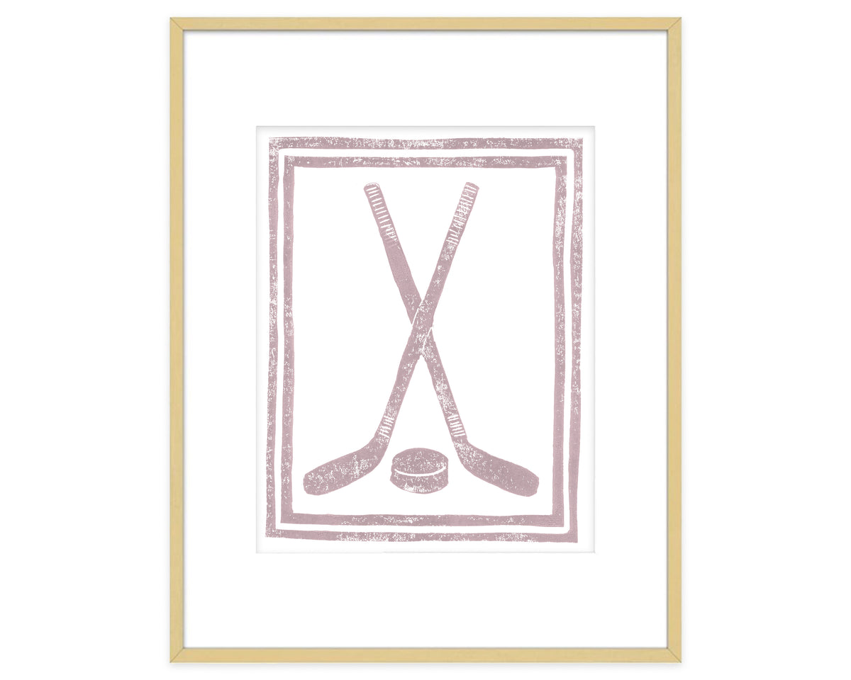 Framed artwork with pink hockey sticks and puck design on a white background