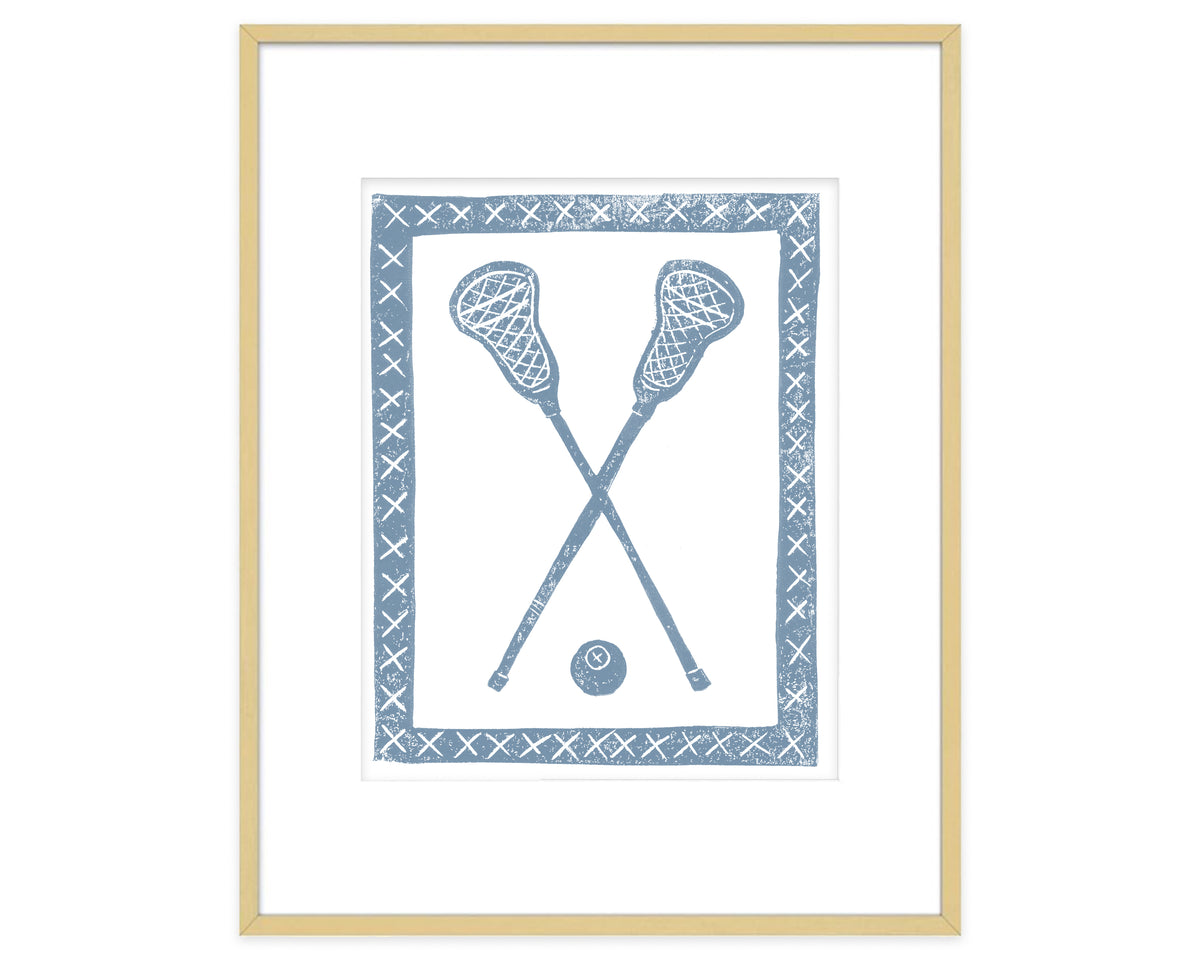 Framed artwork of crossed lacrosse sticks and a ball on a white background