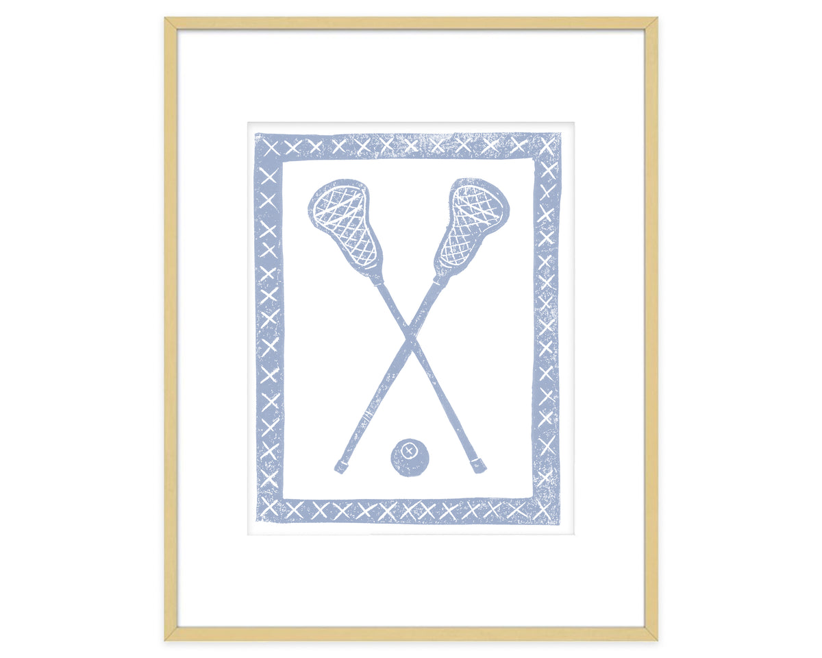 Framed artwork of crossed lacrosse sticks and a ball on a white background
