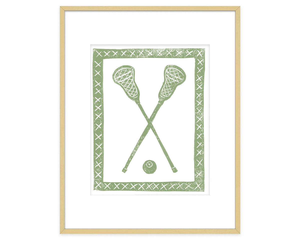 Framed artwork with green lacrosse sticks and ball on a white background