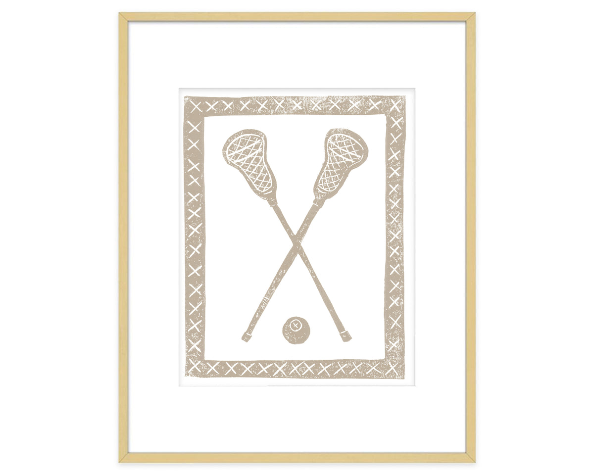 Framed artwork of crossed lacrosse sticks and a ball on a white background