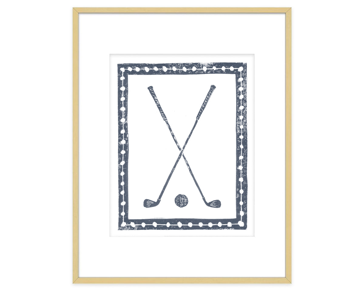 Framed artwork of two crossed golf clubs and a golf ball on a white background