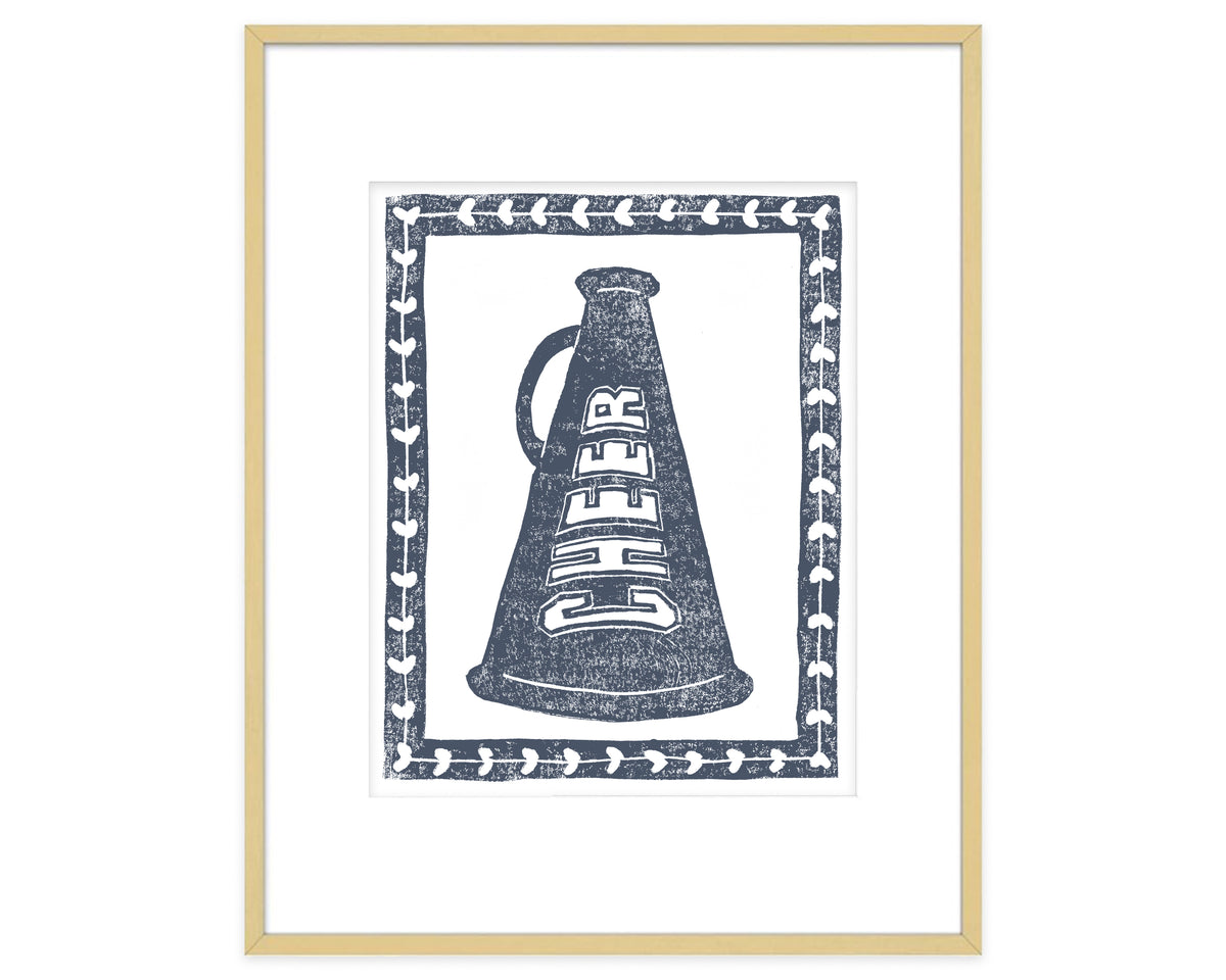 Framed artwork of a megaphone with 'CHEER' text on a white background