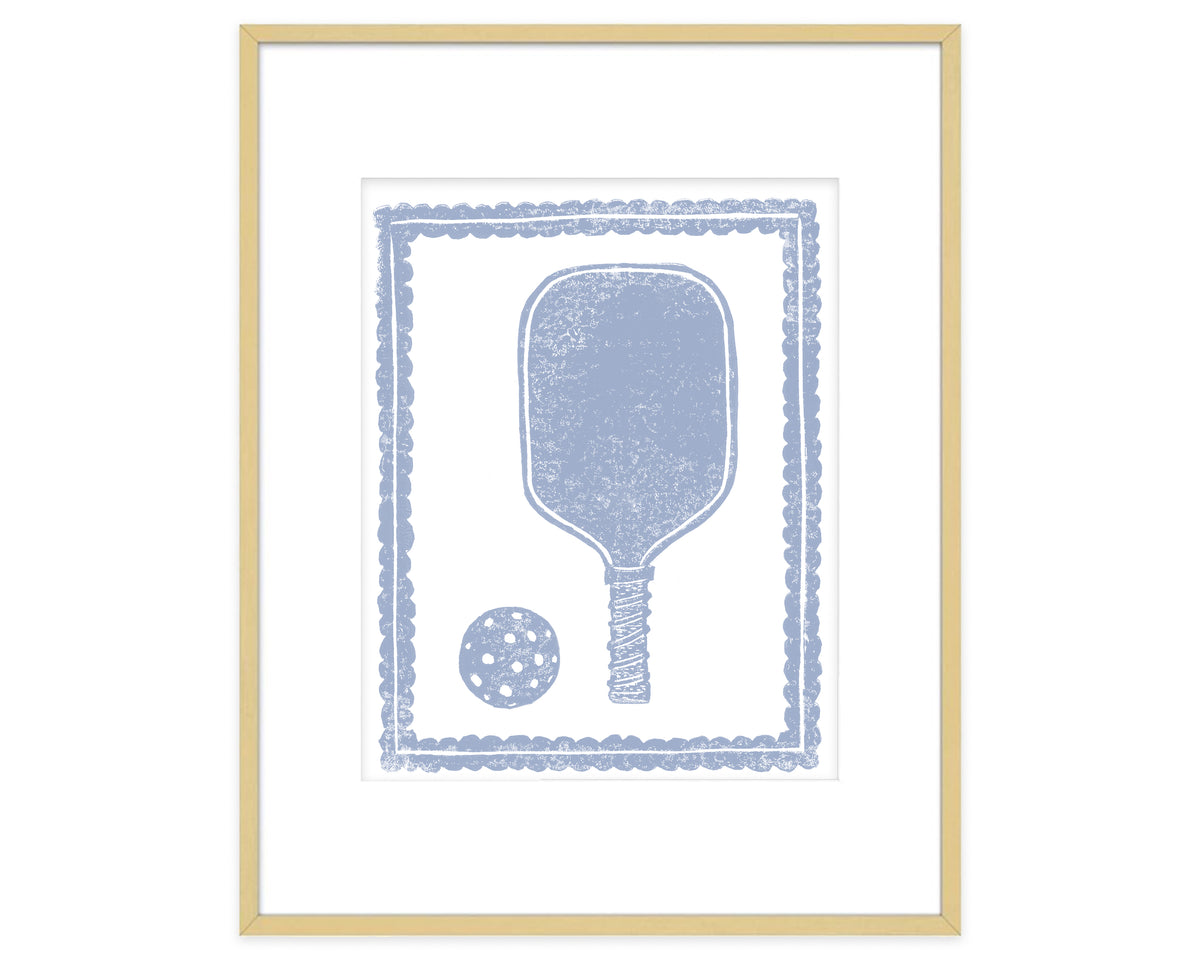 Framed artwork of a pickleball paddle and ball design on a white background