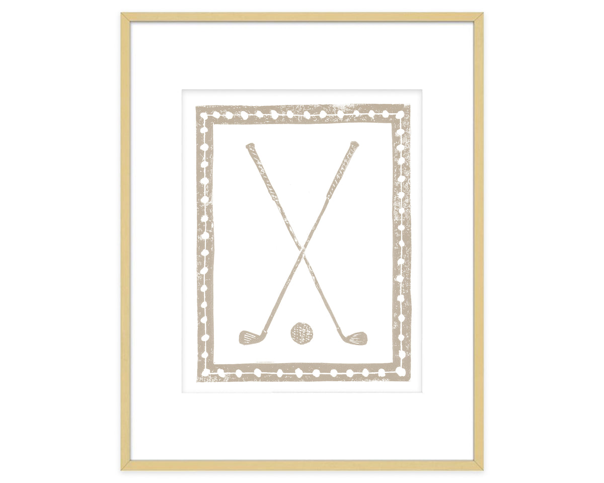 Framed artwork with crossed golf clubs and a ball on a white background
