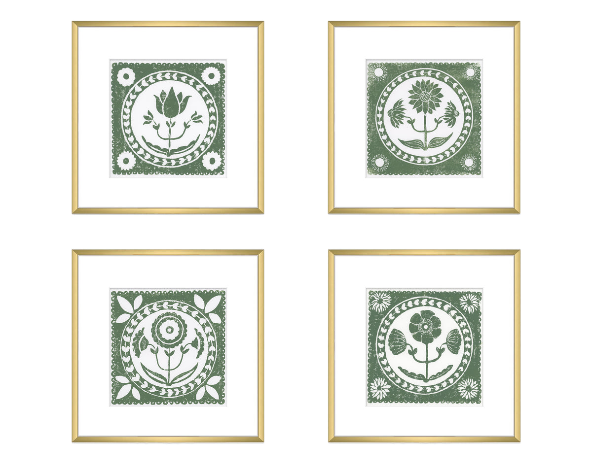 Four framed prints with green floral designs on a white background