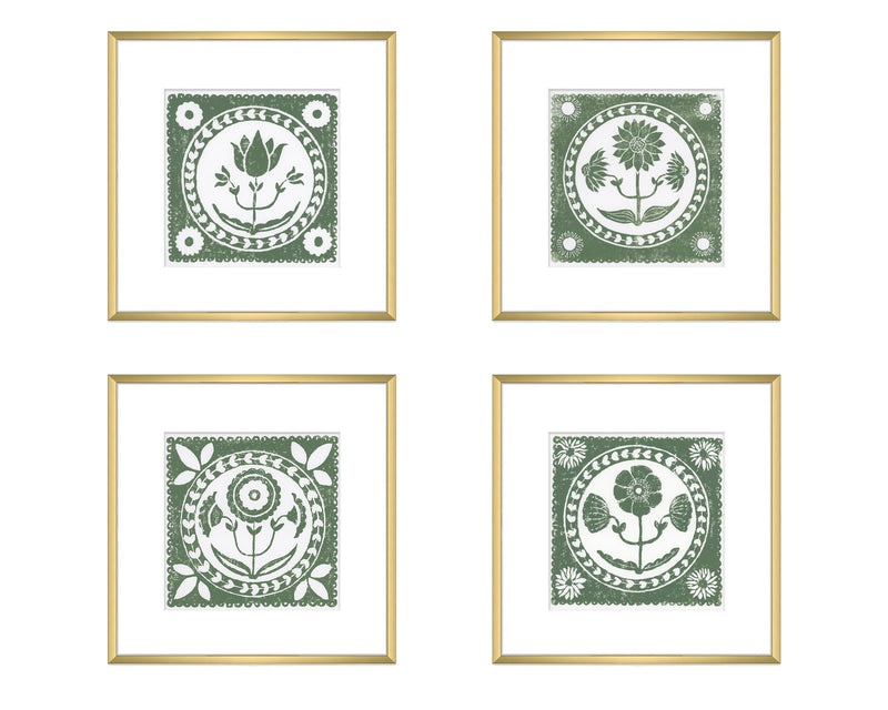 Four framed prints with green floral designs on a white background