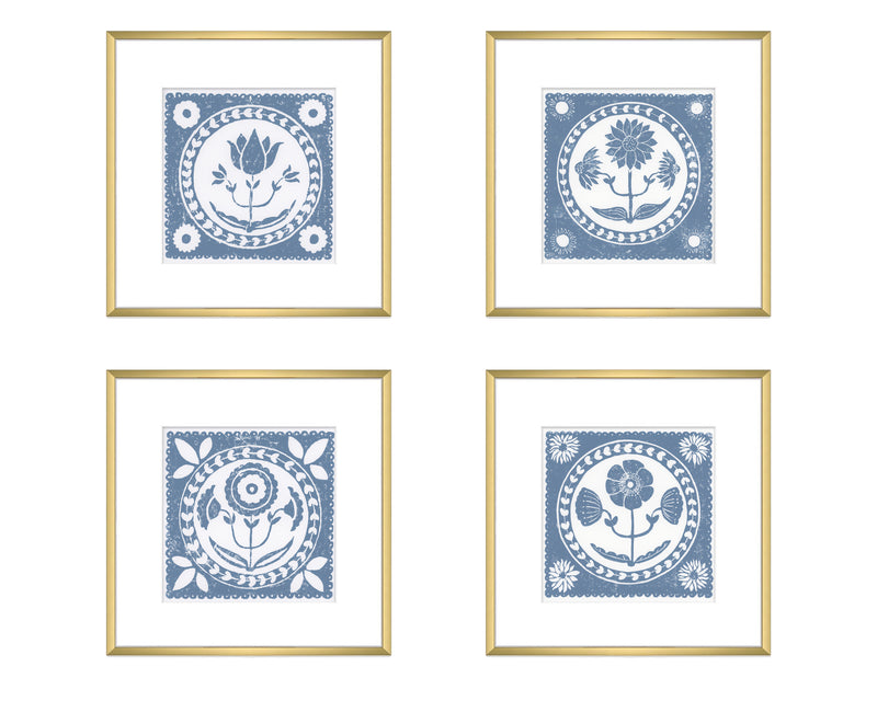 Four framed prints with blue floral designs on a white background