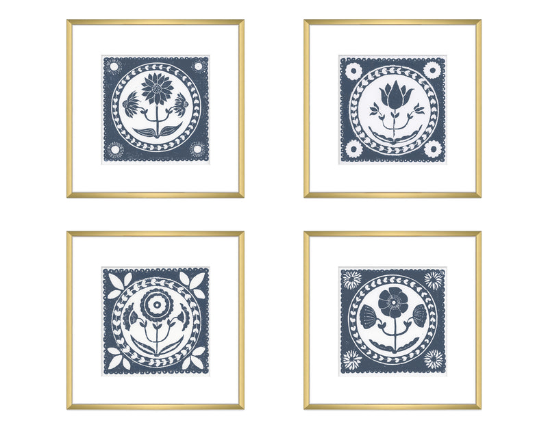 Four framed prints with floral designs on a white background
