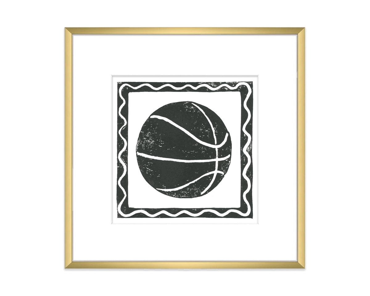 Framed artwork of a black and white basketball design on a white background