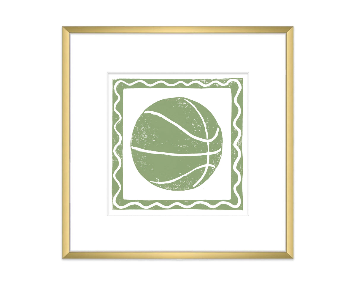 Framed artwork of a green and white basketball design on a white background
