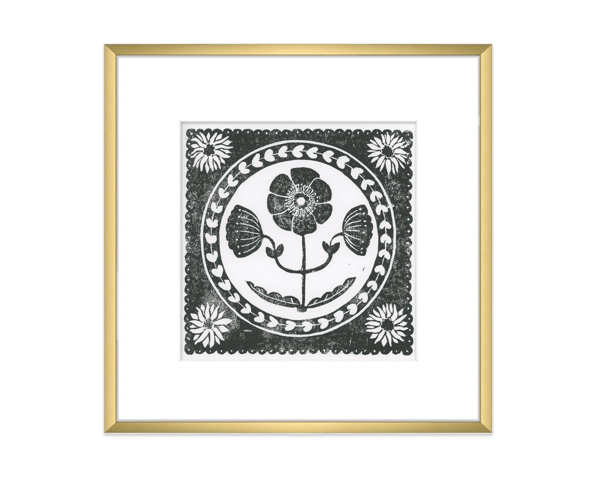 black and white anemone flower block print in a gold matted frame on white background - botanical wall art decor