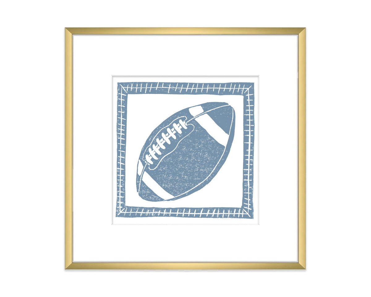 a framed blue and white football on a white background