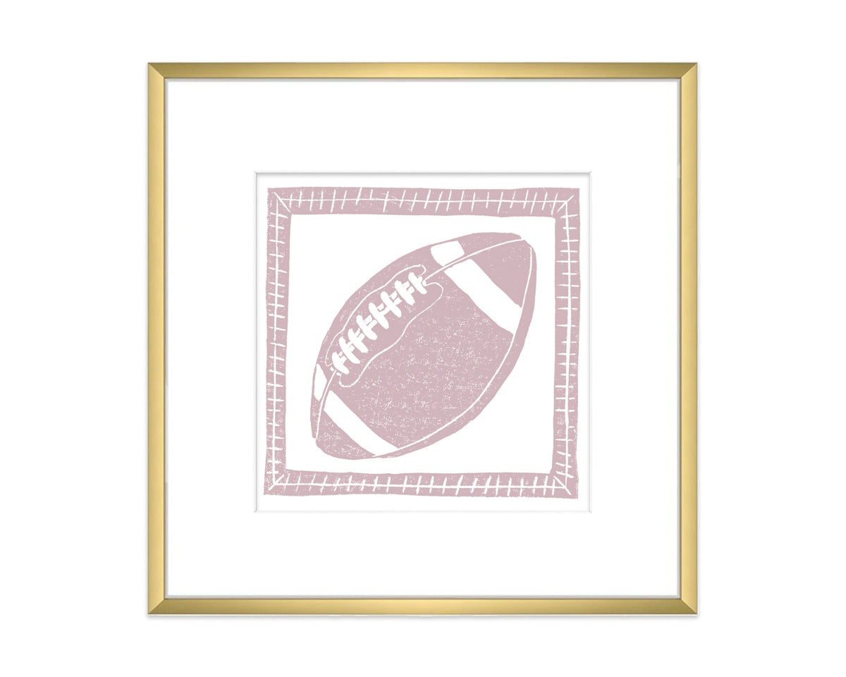 Framed artwork of a pink football on a white background