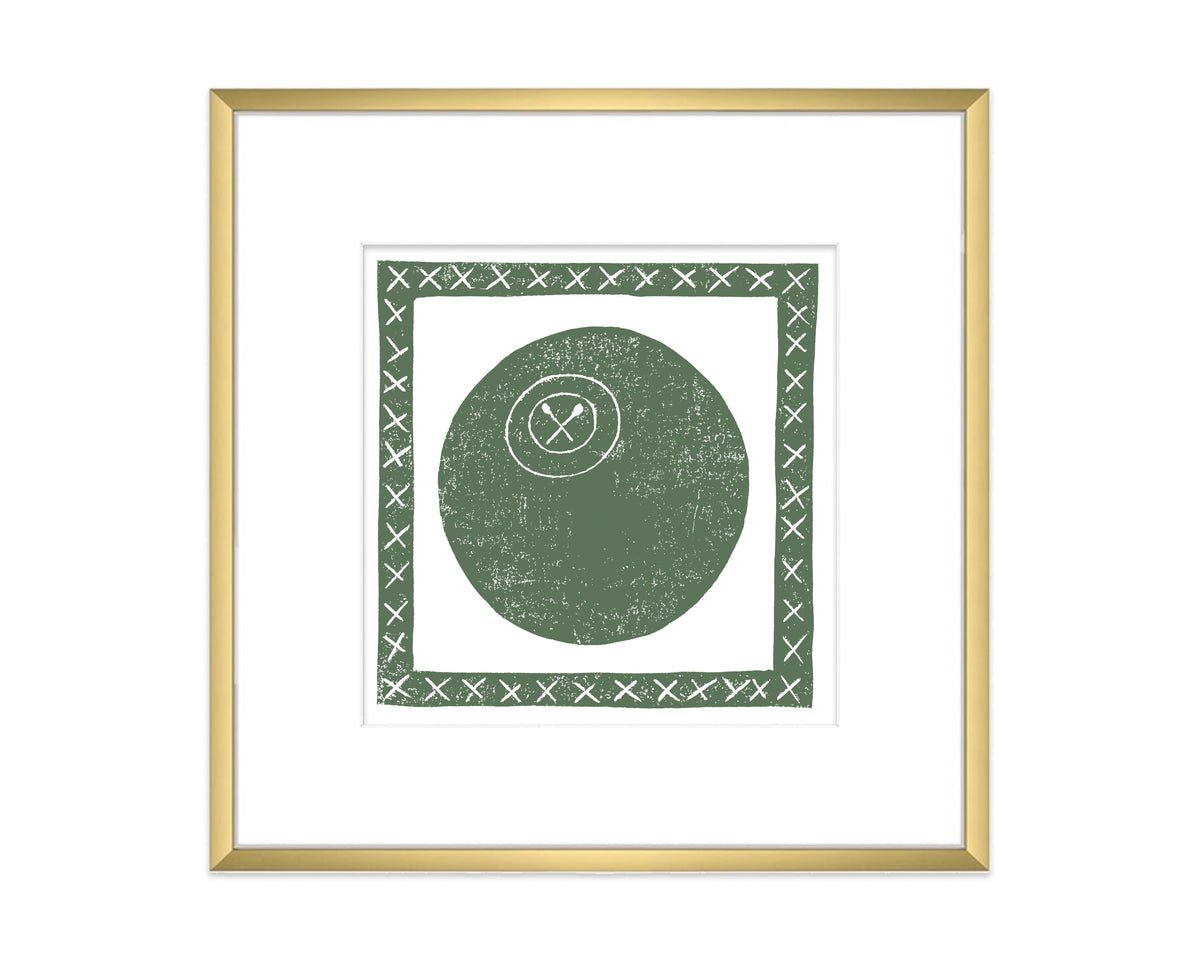 Framed artwork with a green lacrosse ball and cross symbol on a white background