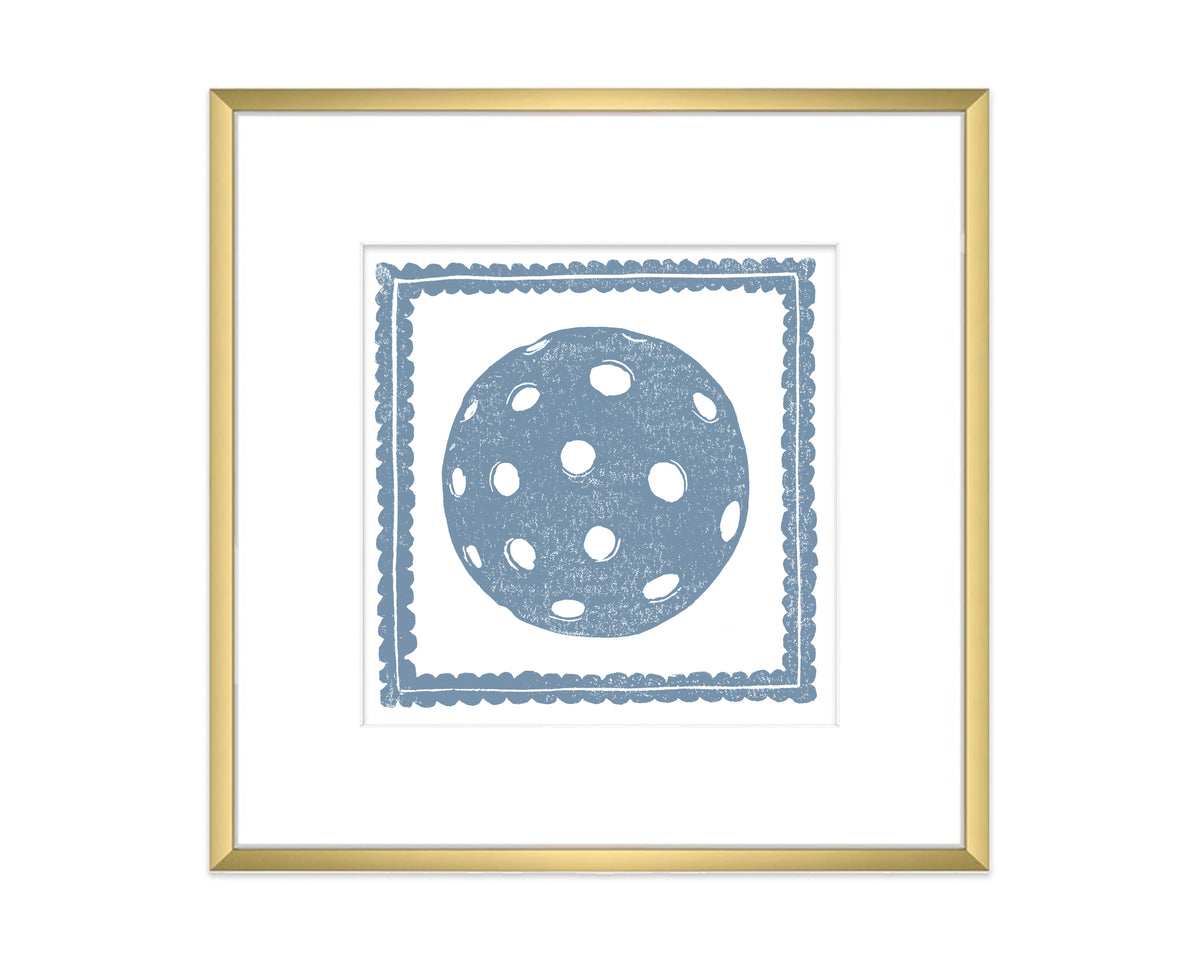Framed artwork with a blue polka dot pickleball design on a white background