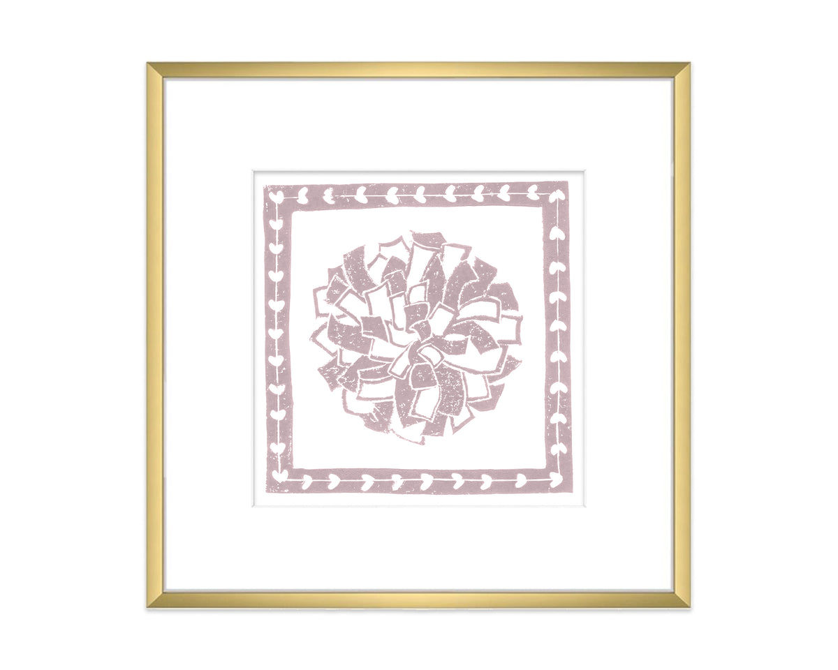 Framed artwork with a decorative pompon design on a white background