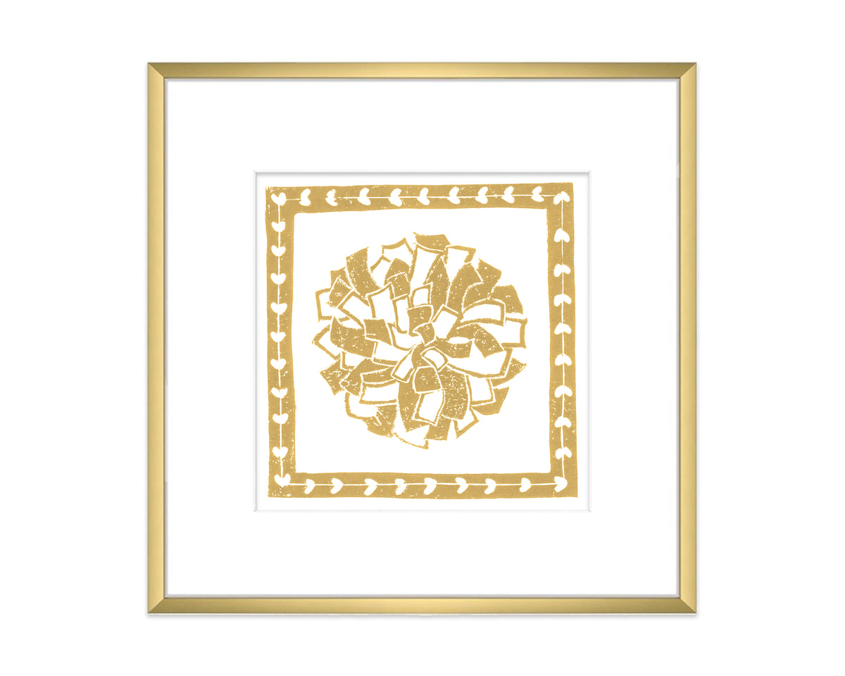 Framed artwork with a gold decorative pompon on a white background