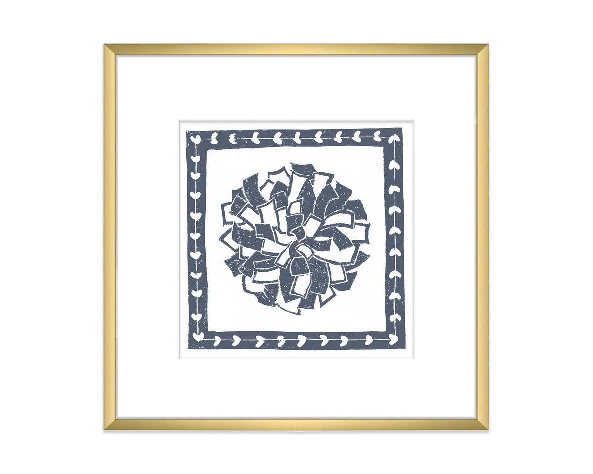 Framed artwork with a decorative pompon design on a white background