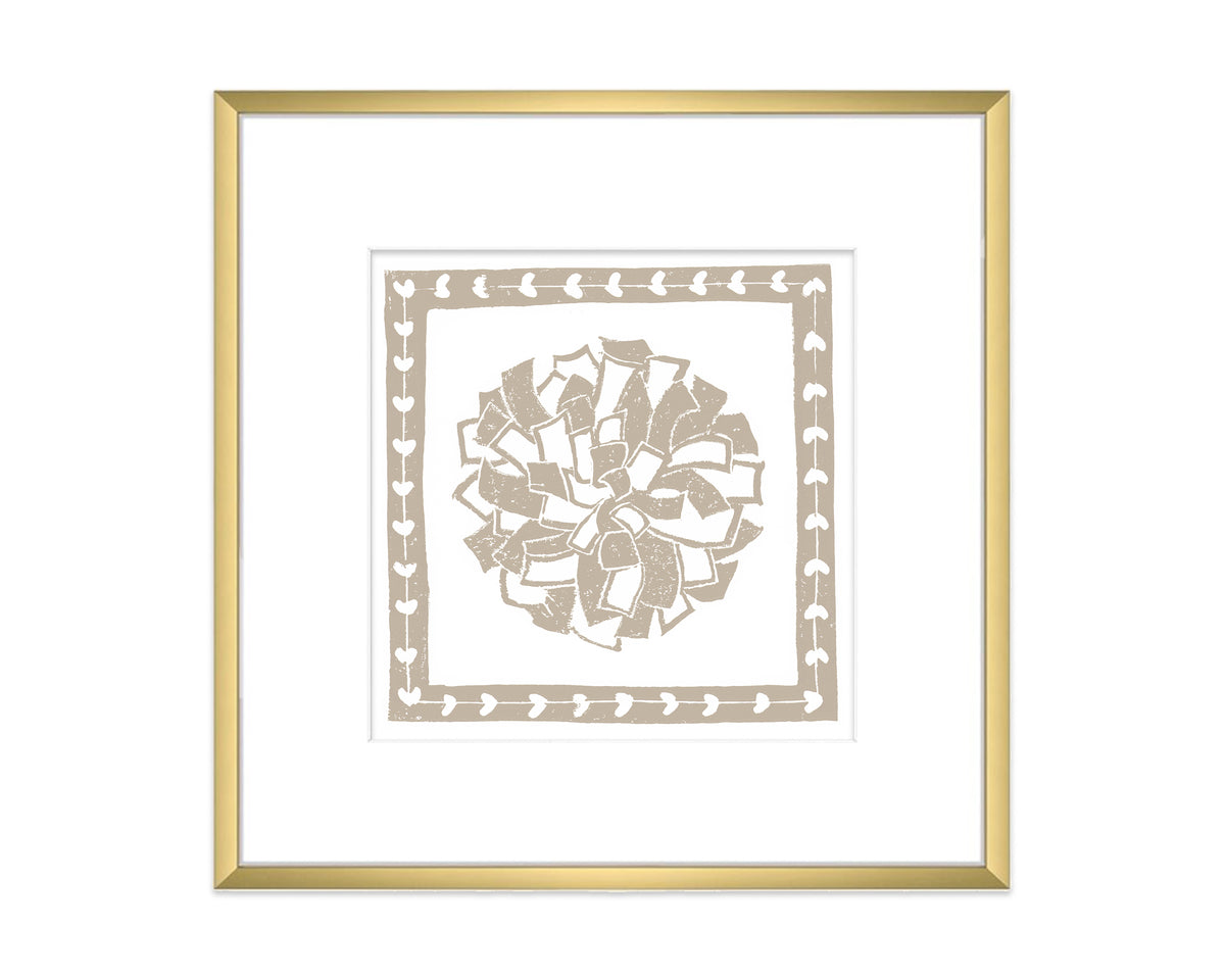 Framed artwork with a decorative pompon design on a white background