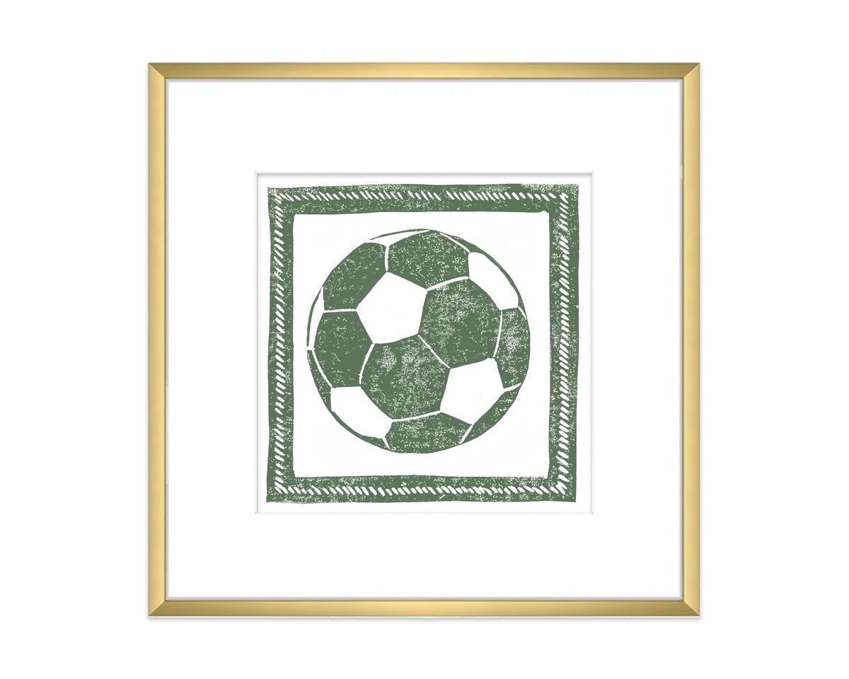 Framed artwork of a green soccer ball design on a white background