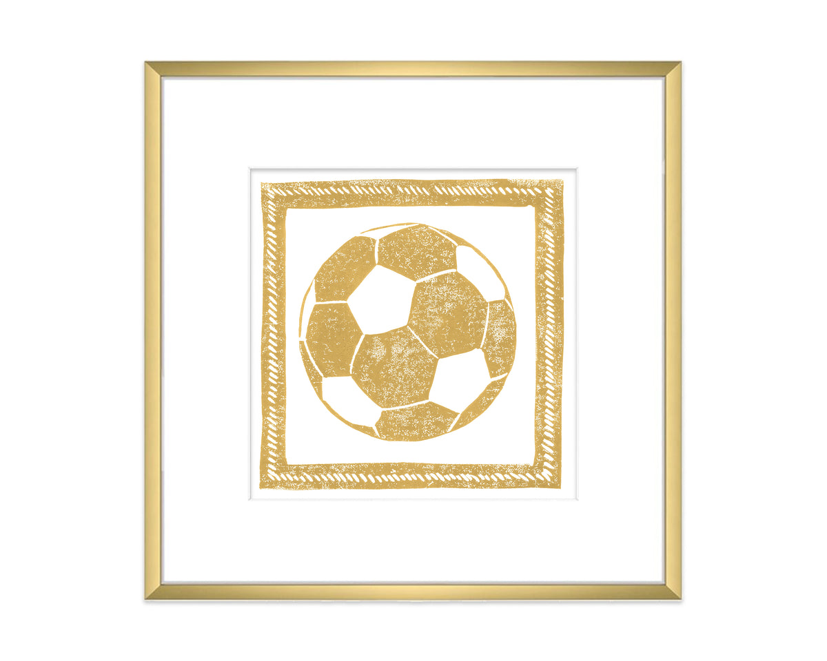 Framed artwork of a gold soccer ball on a white background