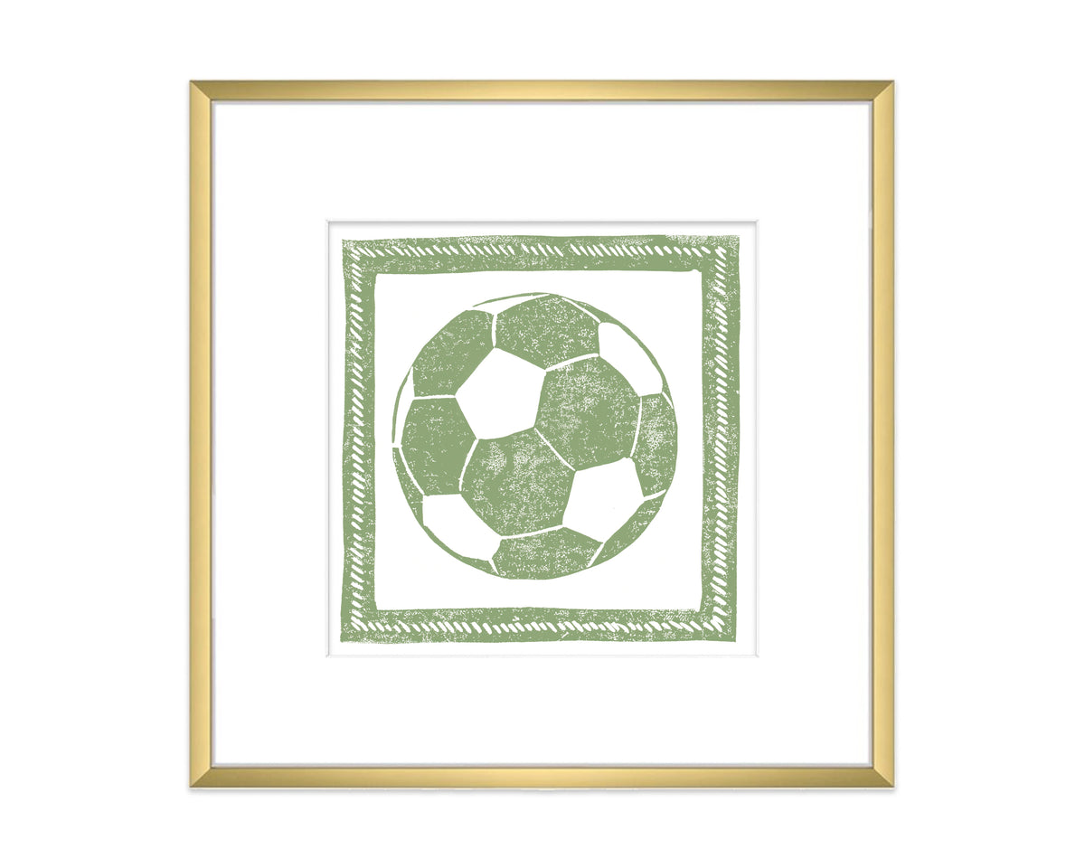 Framed artwork of a green soccer ball design on a white background