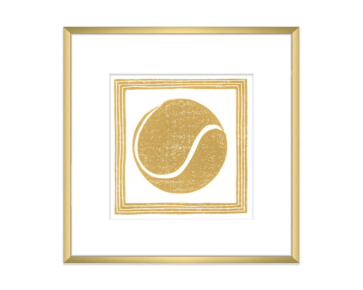Framed artwork with a gold tennis ball design on a white background