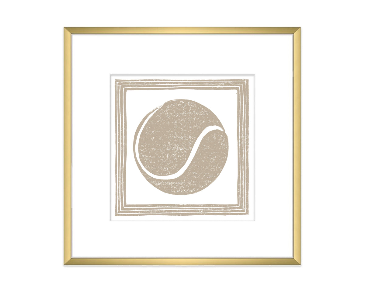 Framed artwork with a tan tennis ball design on a white background