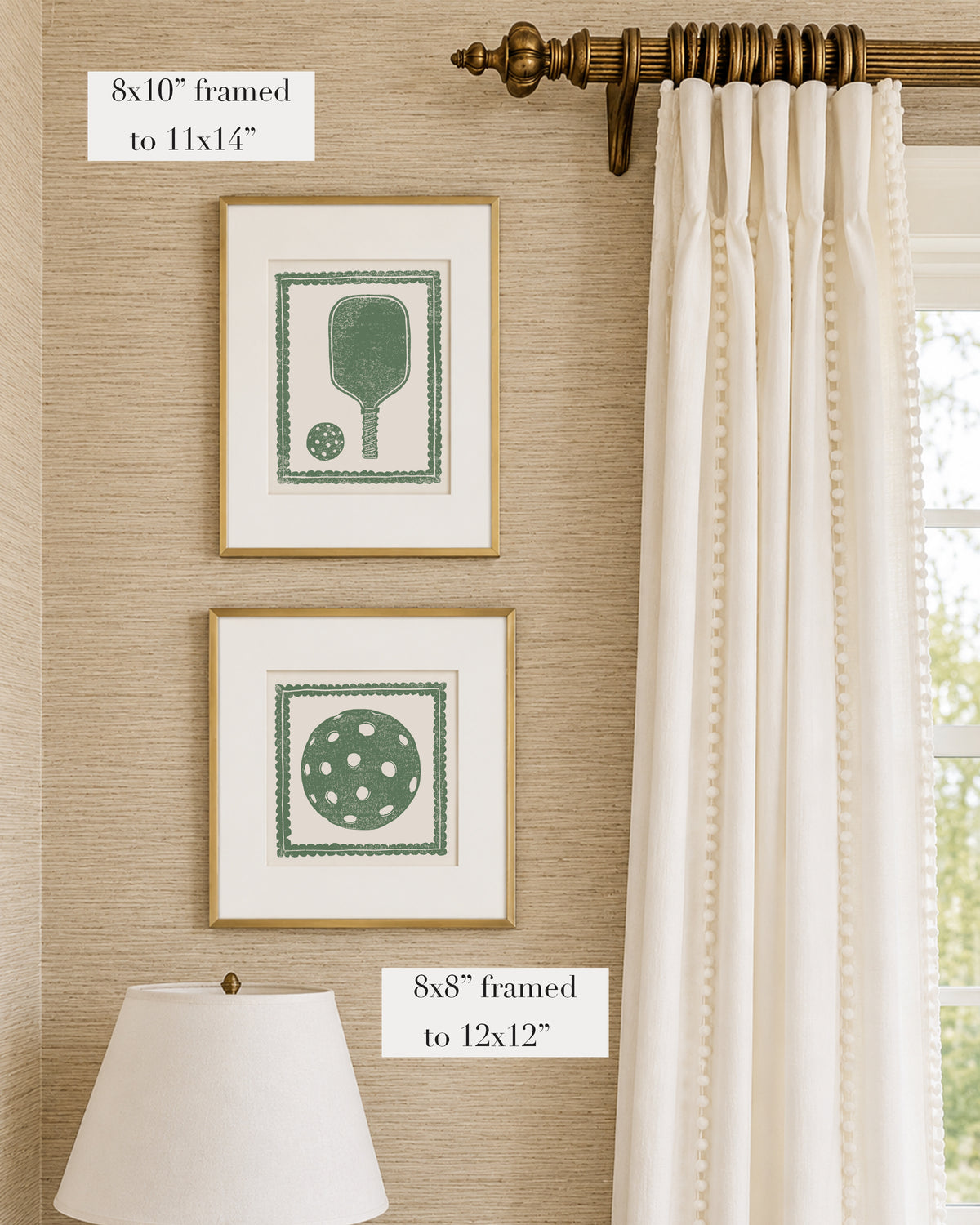 Framed grass green and white pickleball themed artwork on a tan grasscloth wallpapered wall with a white window treatment and lampshade